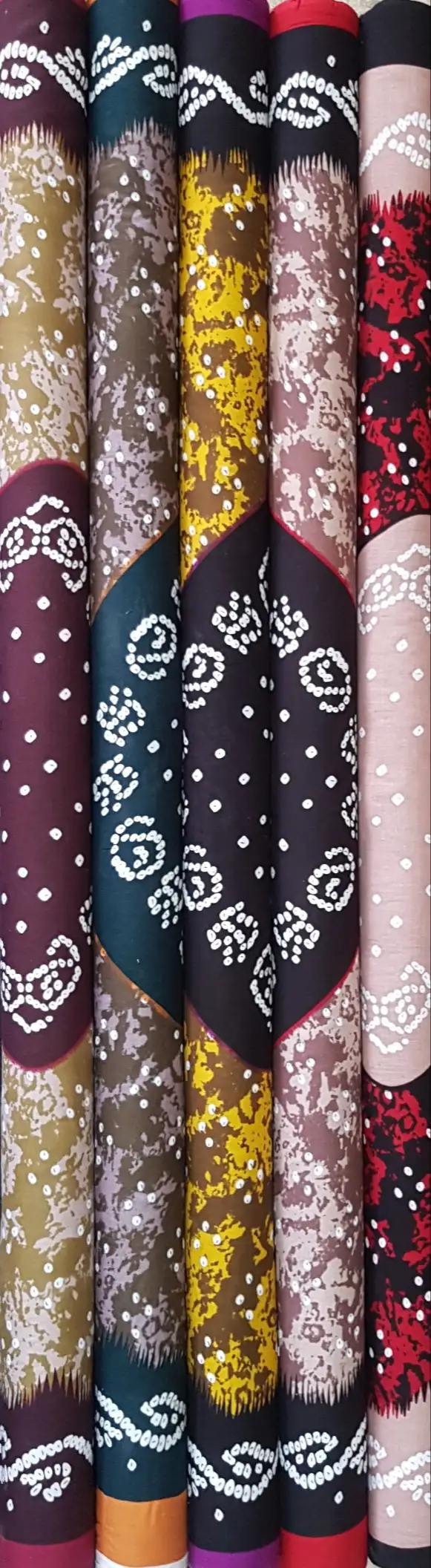 Geometric8 Collection, all colorways shown together. A mottled bandhani-style field of tiny dotted rings frames a smooth central panel edged with scalloped paisley borders.