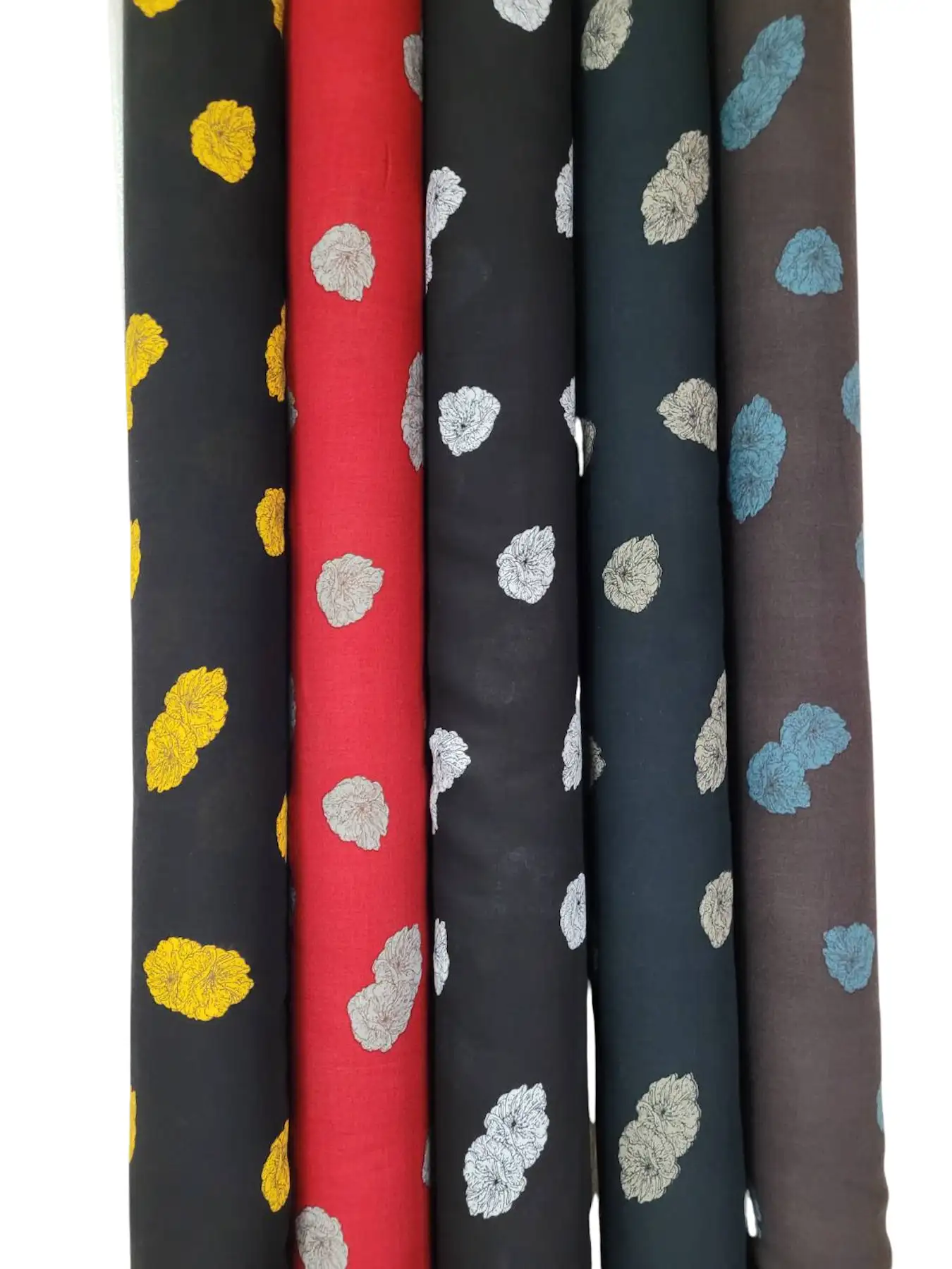 Stripes and Dots15 Collection, all colorways shown together. Scattered textured pom-pom dots, like soft floral puffs, are tossed at random across a plain ground.