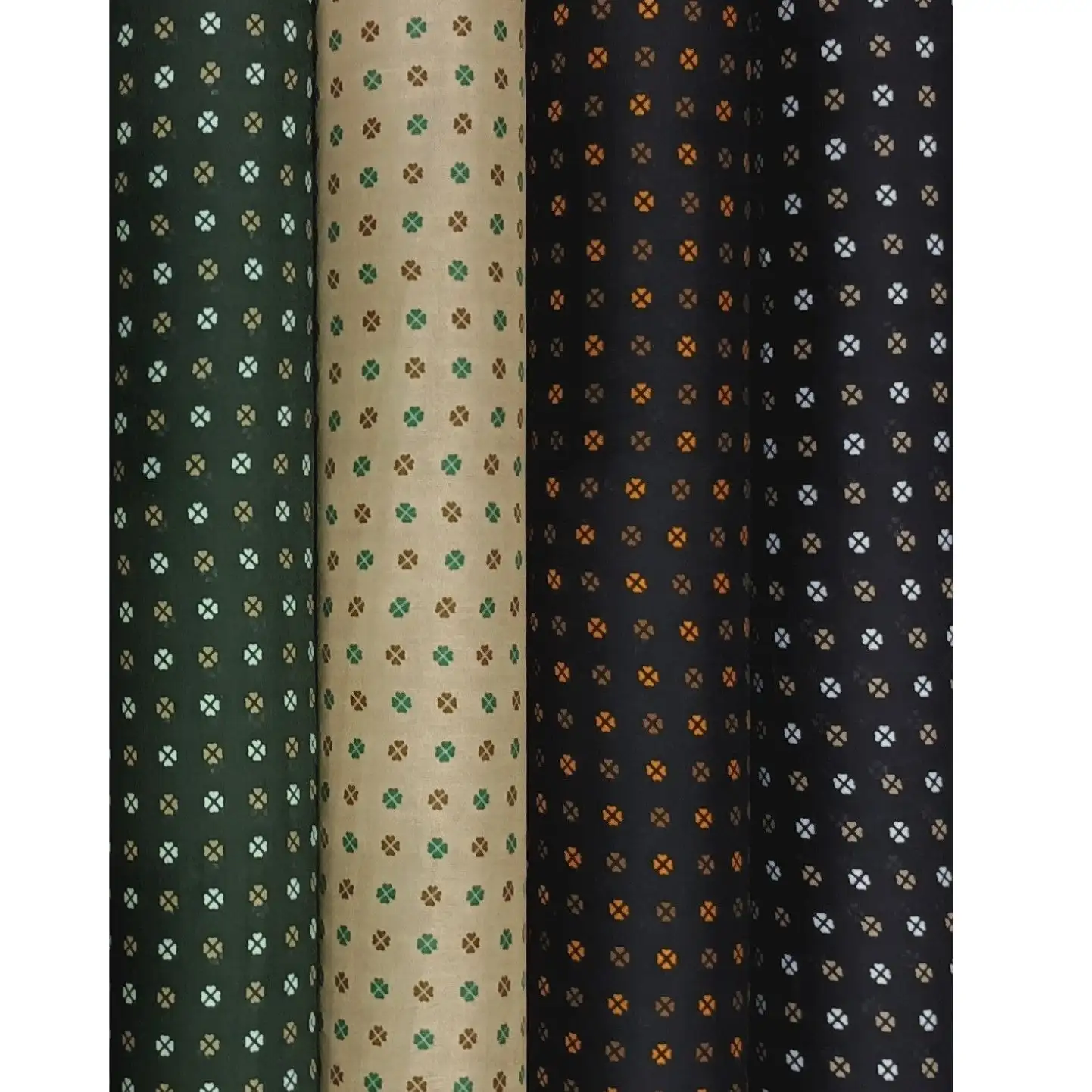 Geometric3 Collection, all colorways shown together. Small circles split by diagonal crosses sit in neat grids, alternating with tiny four-petal flower dots between them.