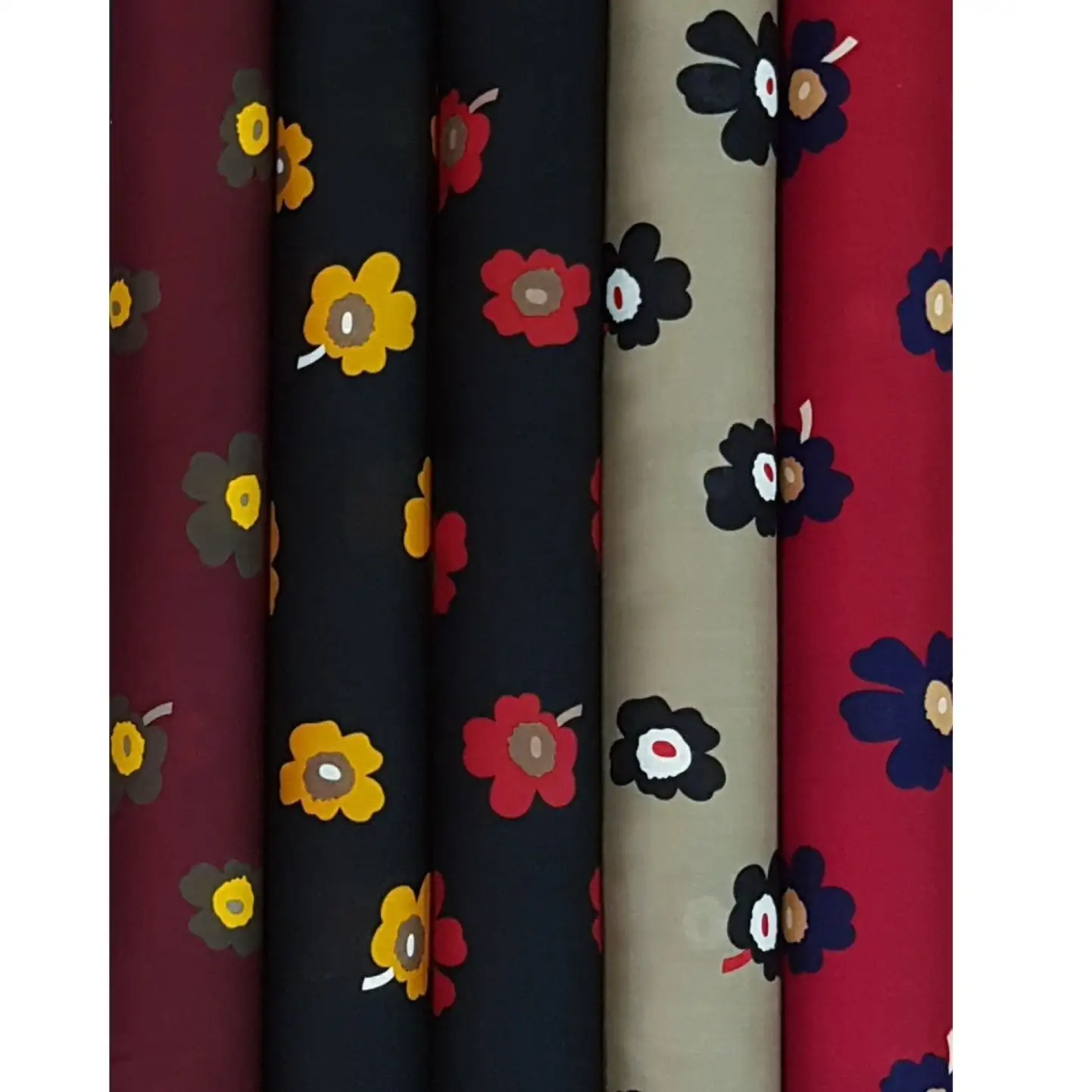 Floral6 Collection, all colorways shown together. Bold simple daisy-style flowers with rounded petals and contrasting centers scatter loosely across the cloth.