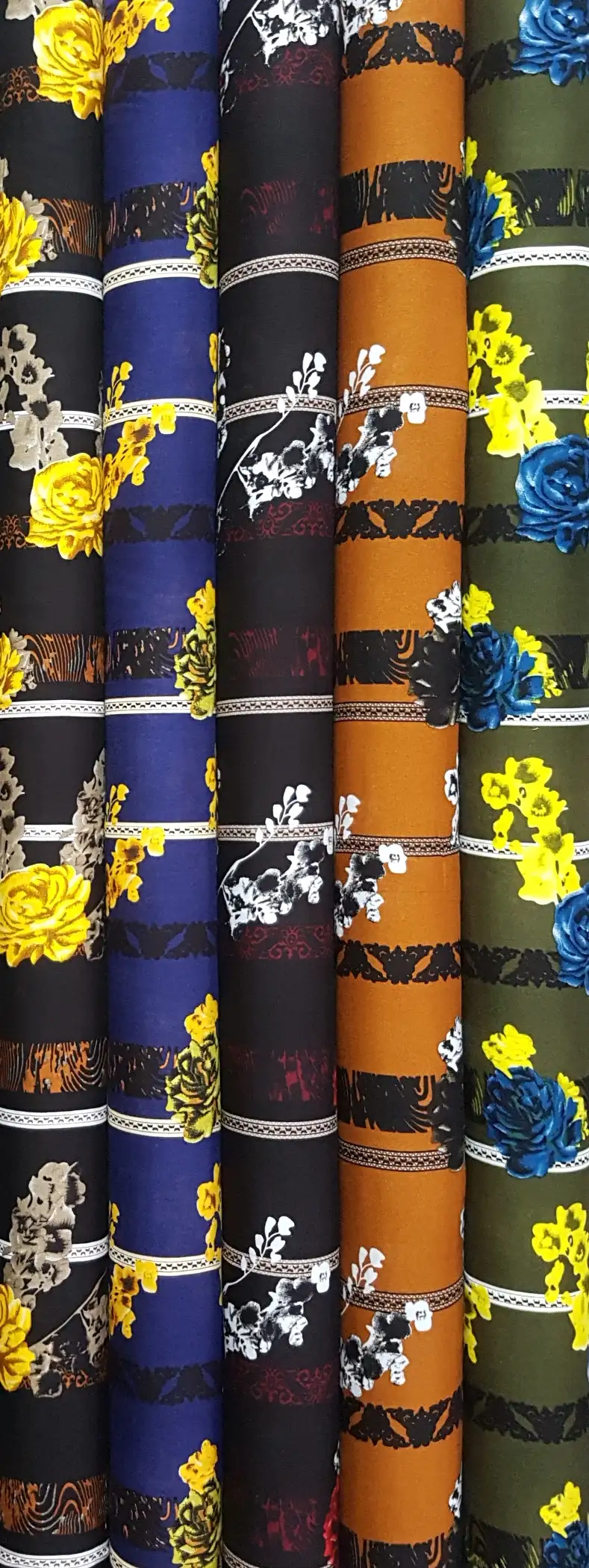 Floral20 Collection, all colorways shown together. Horizontal striped bands of scrolling lace separate rows of large blooming roses and small flower clusters.