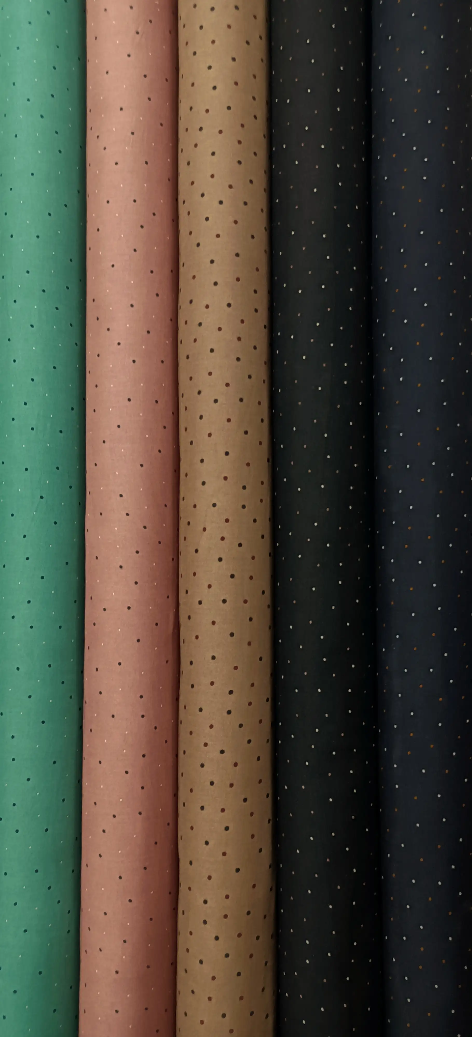 Stripes and Dots20 Collection, all colorways shown together. Evenly spaced small polka dots march in neat rows across a smooth solid ground.