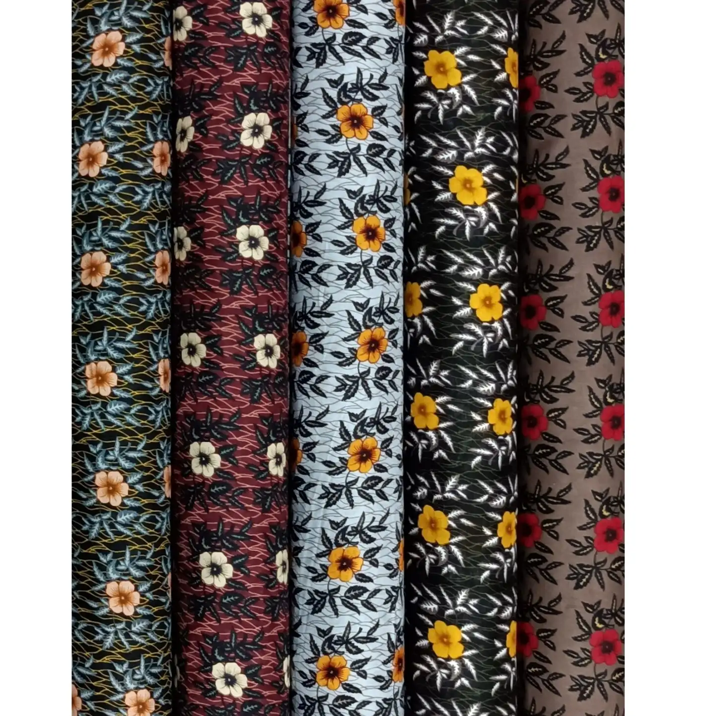 Floral3 Collection, all colorways shown together. Small five-petal blossoms scatter across slender leafy stems in an allover ditsy floral pattern.