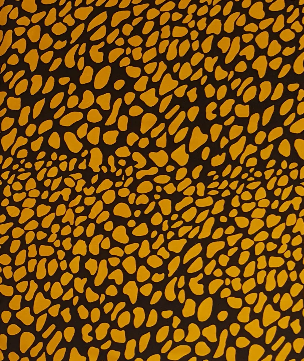 Stripes and Dots4 Collection in Black. Tan and golden-amber pebbles set in bold black outlines over a dark brown ground.