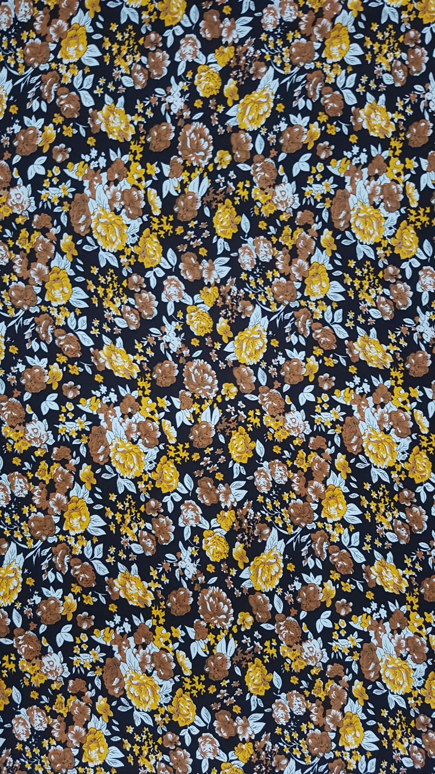 Floral9 Collection in Black. Black ground packed with golden-amber roses, small white blossoms, and pale leaves.