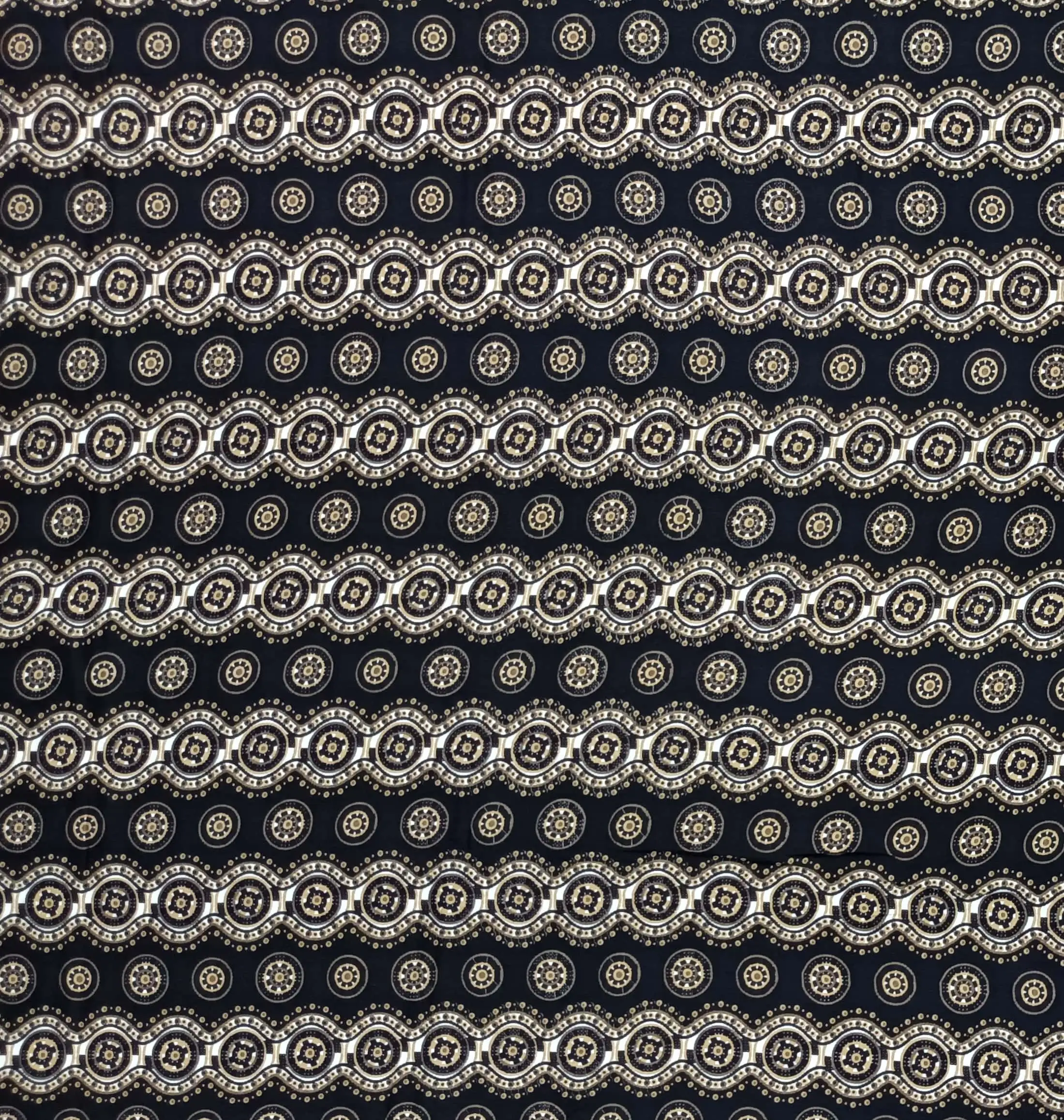 Geometric4 Collection in Black. Deep teal-green ground carrying cream, gold and grey medallions outlined by pale beaded scallops.