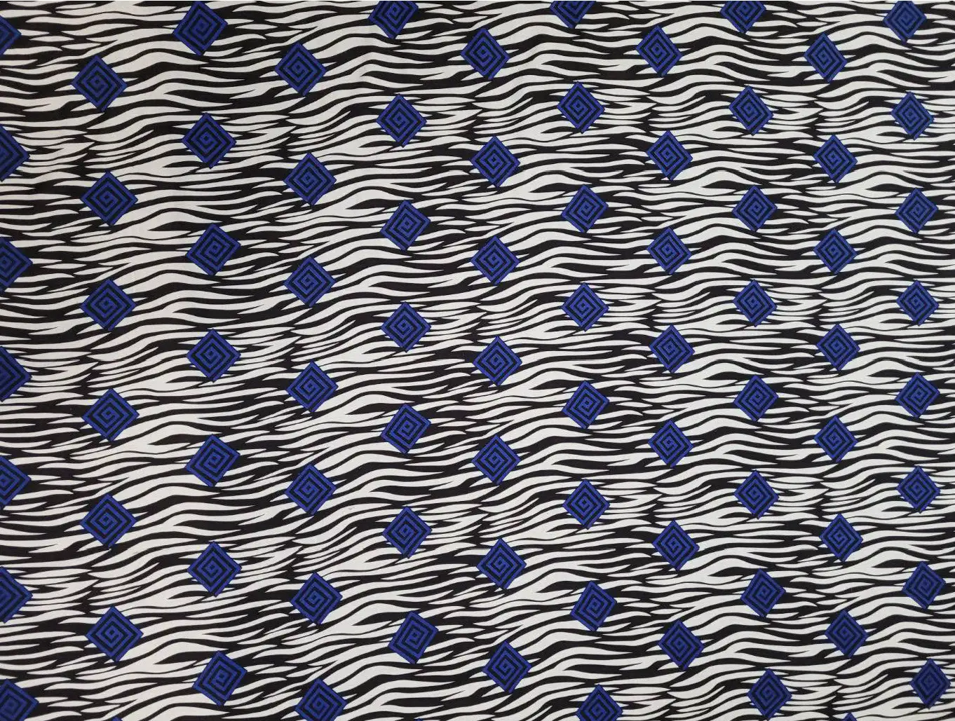 Stripes and Dots17 Collection in Blue. Crisp white-and-black zebra stripes carry navy-blue maze diamonds outlined in matching blue.