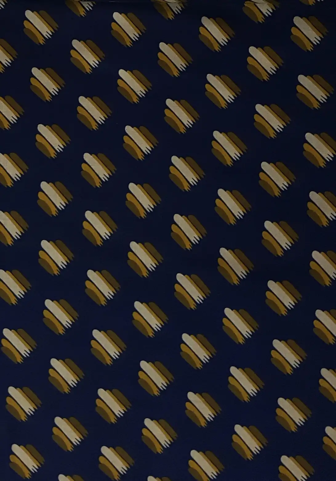 Geometric5 Collection in Blue. Navy ground scattered with red, white and tan striped blocks edged in steel blue.