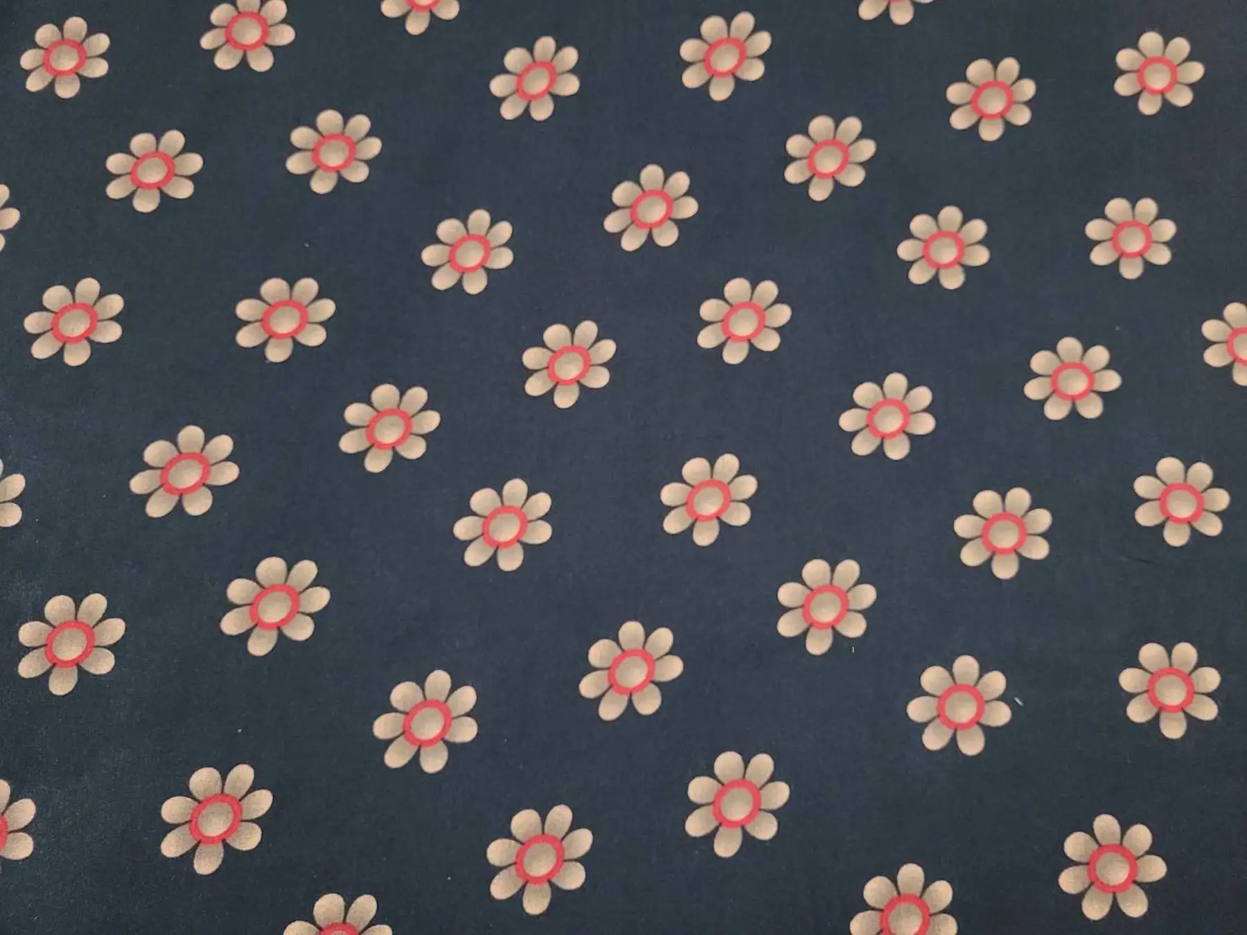 Floral11 Collection in Cream. Deep forest-green ground scattered with grey daisies ringed in white around pale centers.