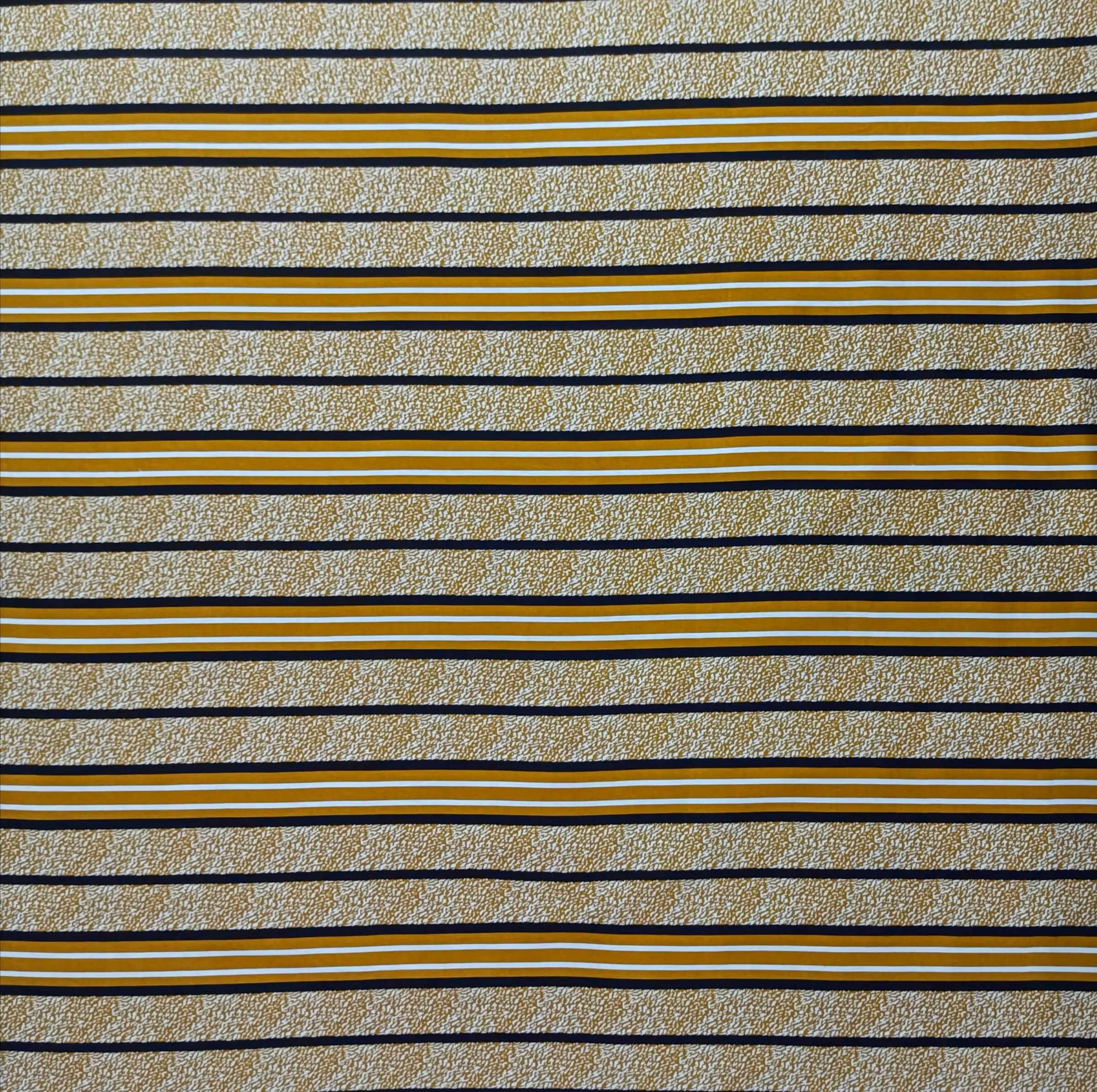 Stripes and Dots19 Collection in Cream. Speckled blush-pink ground crossed by black, white, and mustard horizontal stripe bands.