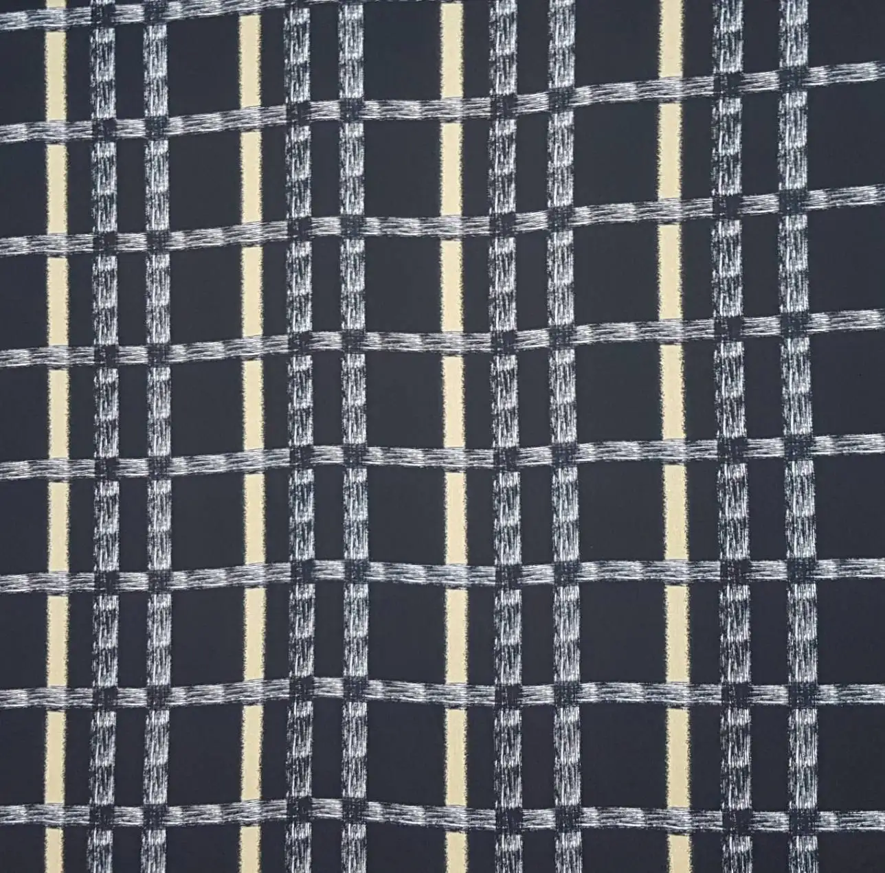 Stripes and Dots7 Collection in Black Yellow. Dark charcoal ground banded in golden amber, with cream-flecked cross stripes ruling the plaid.