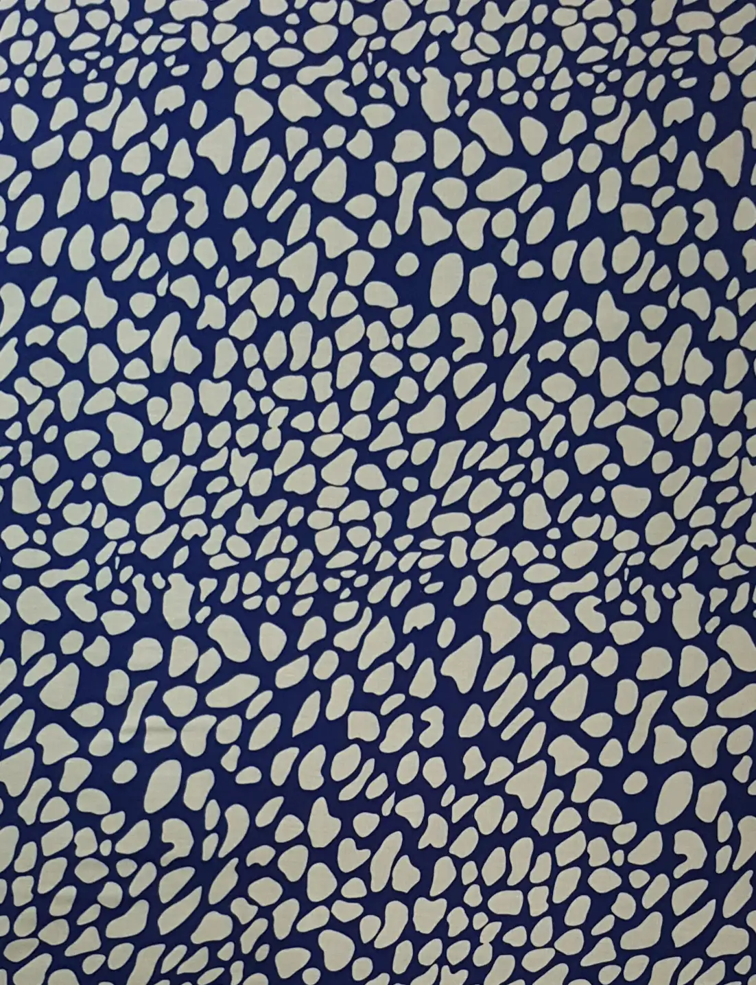 Stripes and Dots4 Collection in Blue. Pale grey-blue stones scattered across a deep navy blue background with crisp edges.
