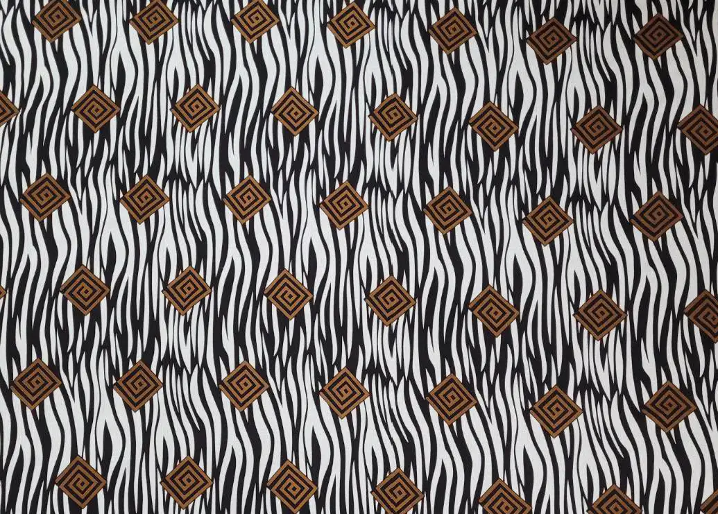 Stripes and Dots17 Collection in Brown. Tan ground with dark-brown tiger stripes and deep-purple spiral diamond medallions scattered across it.
