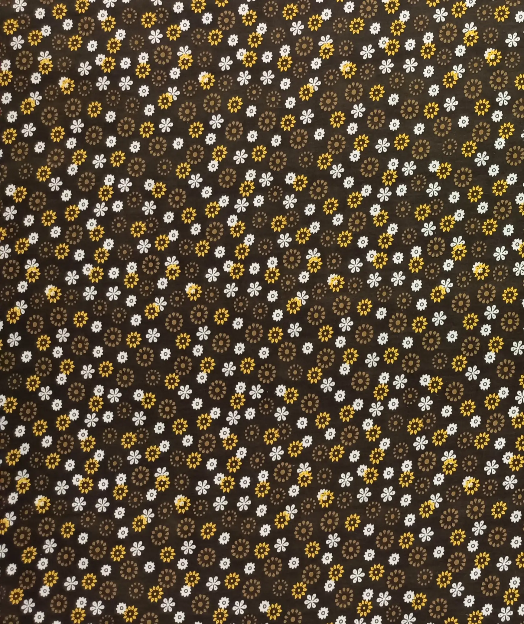 Floral2 Collection in Brown. Soft sage-olive ground patterned with orange, charcoal, and white flowers in mixed warm tones.