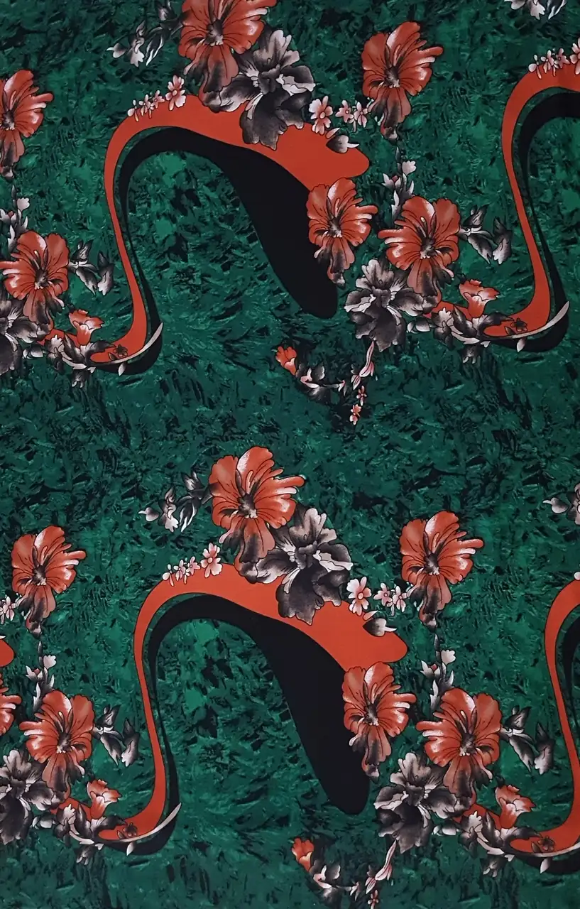 Floral19 Collection in Green. Emerald green field carrying rust-orange and teal blooms with grey-shaded centers.