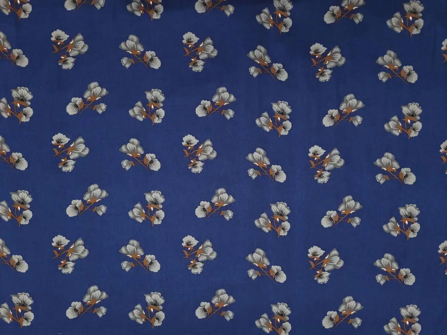 Floral12 Collection in Grey Flower. Deep navy blue ground printed with soft silver-grey flowers and pale grey trailing foliage.