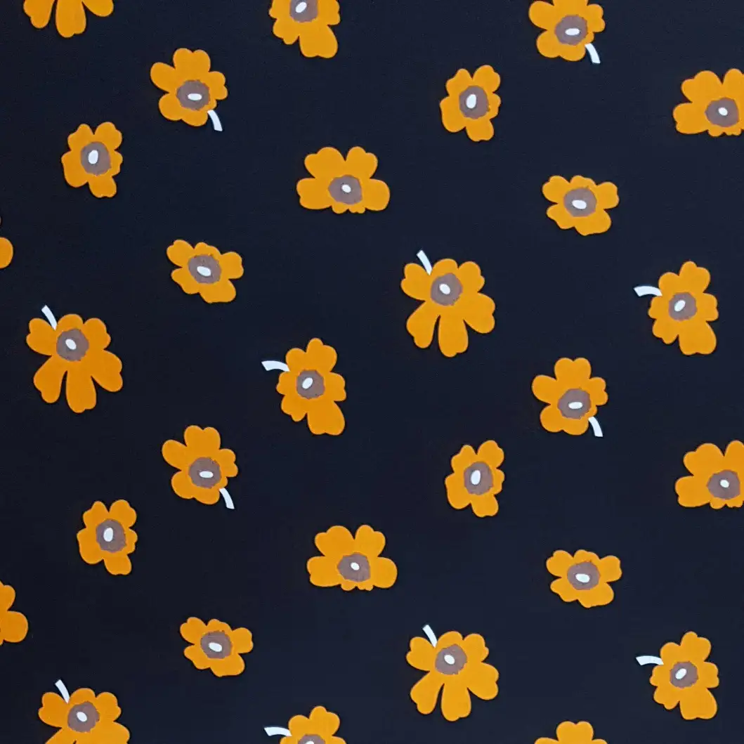 Floral6 Collection in Black Yellow. Black ground dotted with golden-yellow daisies showing warm brown and cream eyes.
