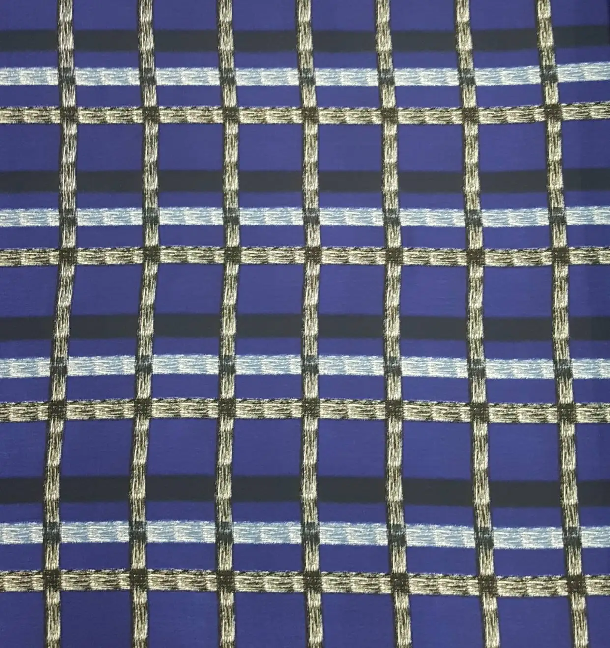 Stripes and Dots7 Collection in Blue Black. Bright cobalt blue ground gridded by black and white frayed lines in a bold windowpane.