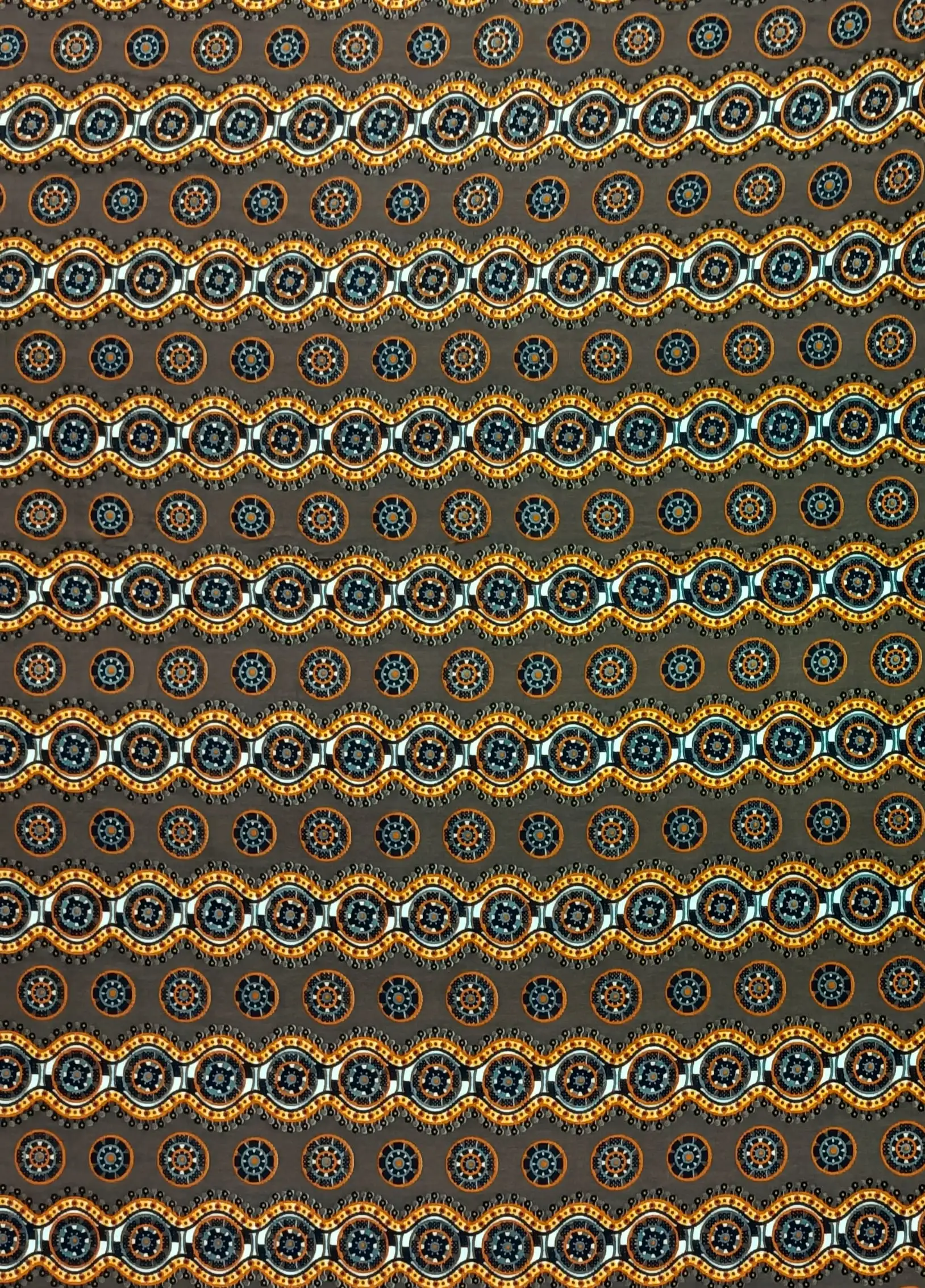 Geometric4 Collection in Brown. Near-black ground patterned with ivory, gold and silver medallions and bright cream rosette dots.