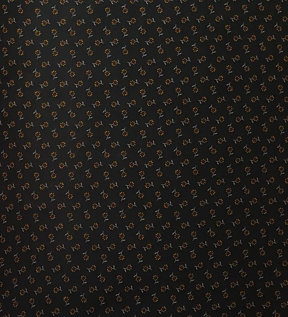 Floral5 Collection in Dark Brown. Deep maroon-brown ground printed with soft pink petal sprigs and slim leafy stems.