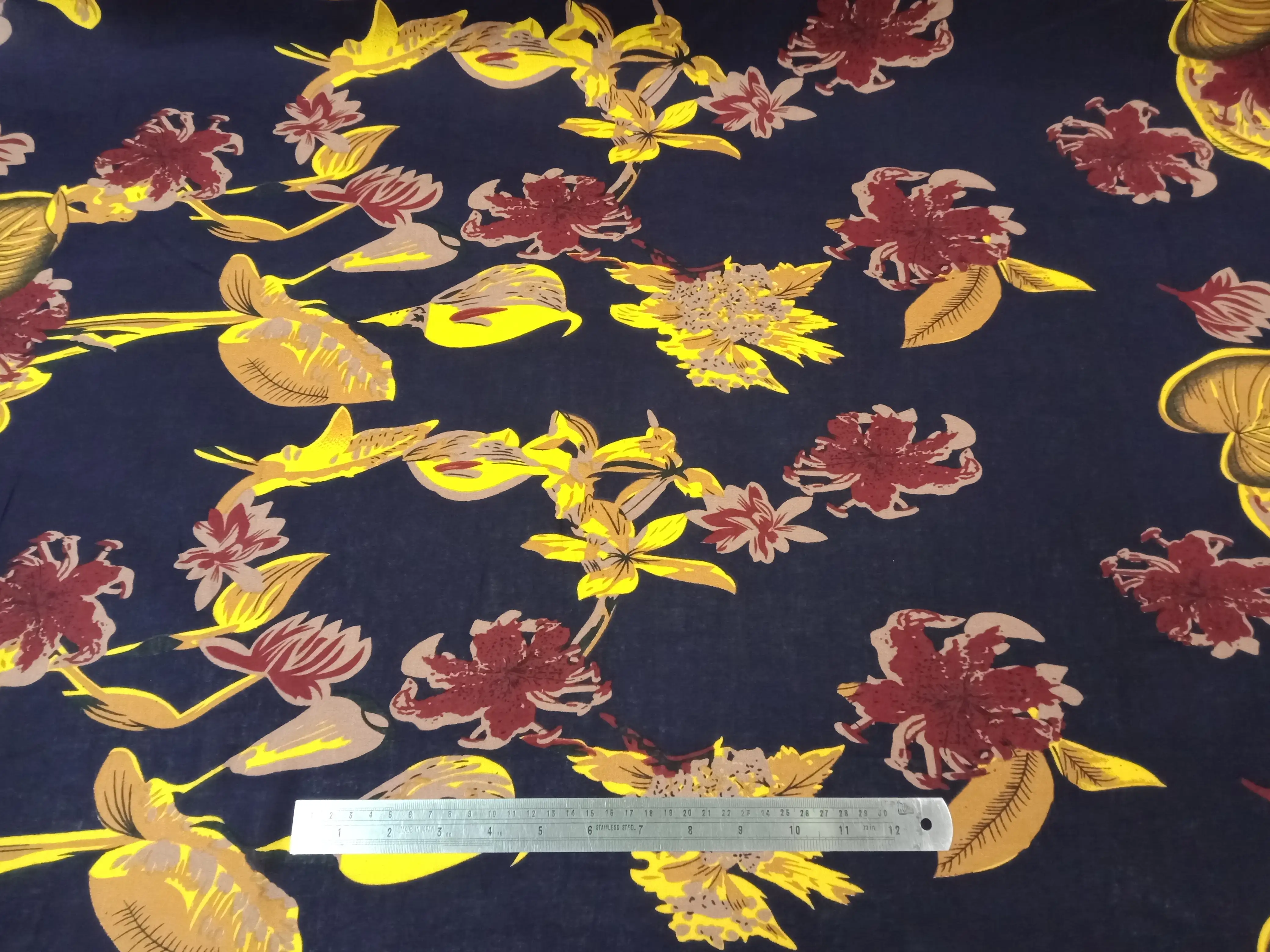 Floral8 Collection in Floral Navy Blue. Navy blue ground with mustard-yellow flowers and soft grey-green leaves throughout.