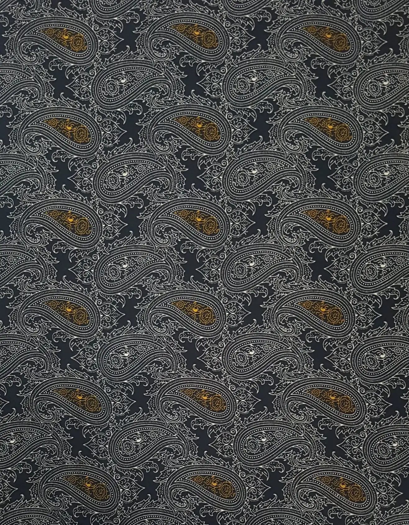 Geometric16 Collection in Gold. Cool grey ground patterned in dark ink, lit by glowing antique-gold paisley accents.
