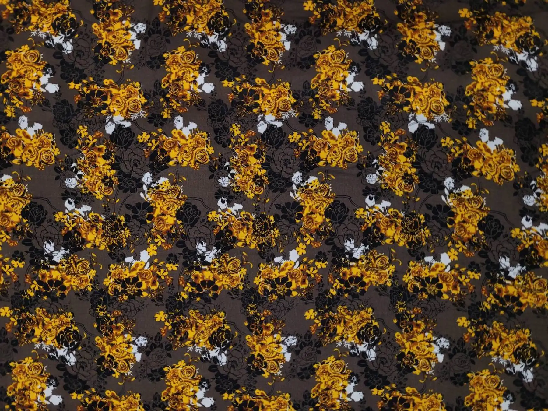 Floral10 Collection in Grey. Near-black charcoal ground with crimson-red roses and tan flowers among muted leaves.