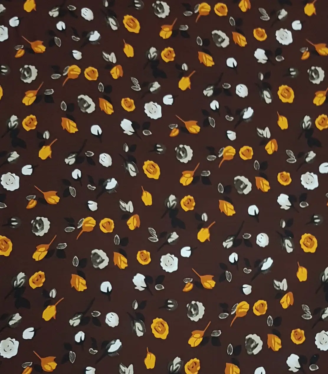 Floral18 Collection in Brown. Maroon brown field strewn with orange, mustard and ivory roses among soft green foliage.