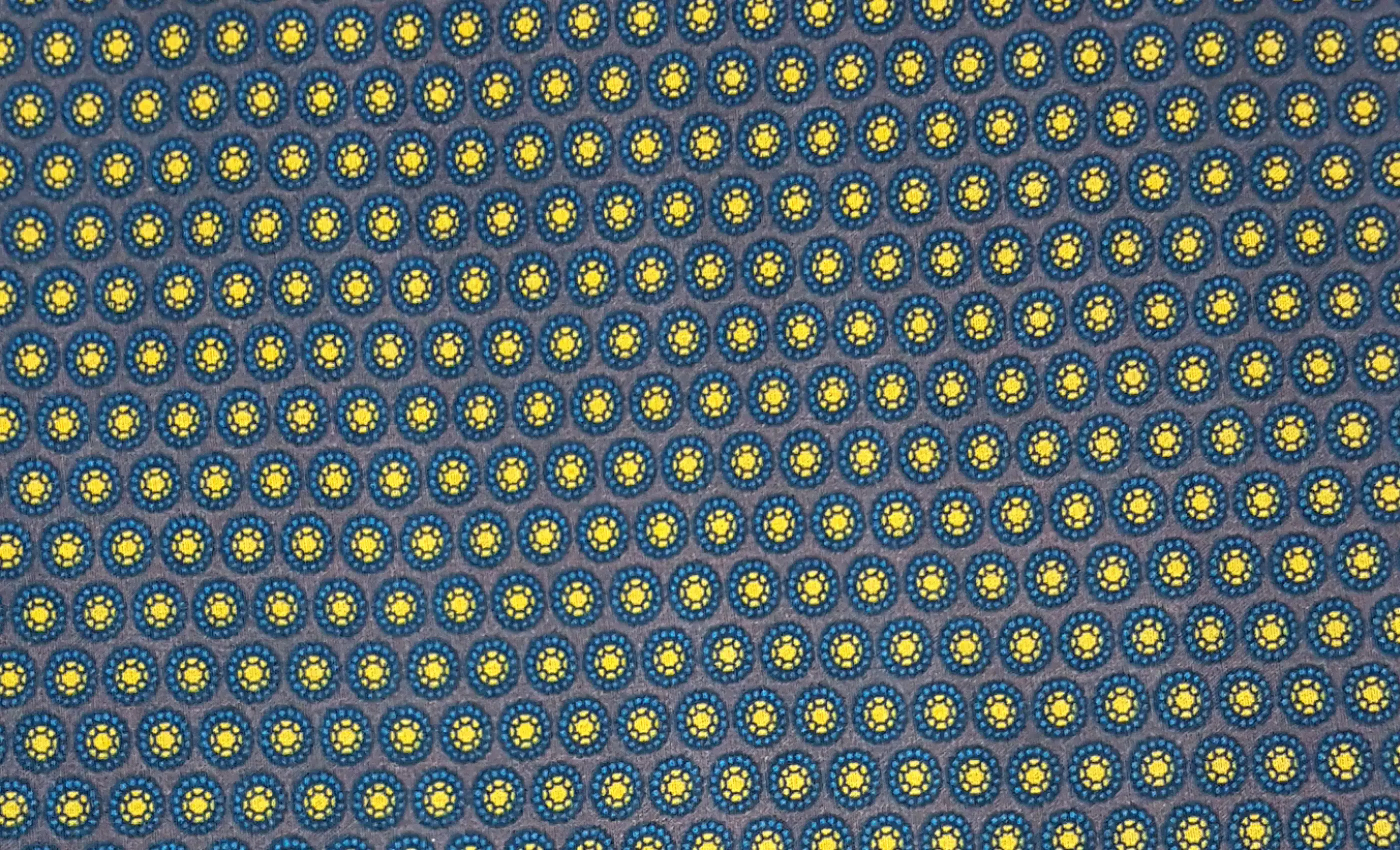 Stripes and Dots13 Collection in Purple. Muted purple-grey ground patterned with lavender and pale dots set in tight hexagons.