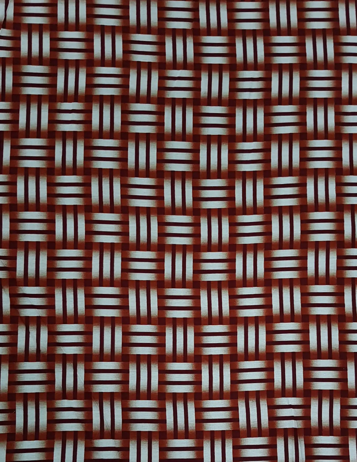 Geometric6 Collection in Red. Rich brick-red ground threaded with white and gray bars forming the interlocked grid.