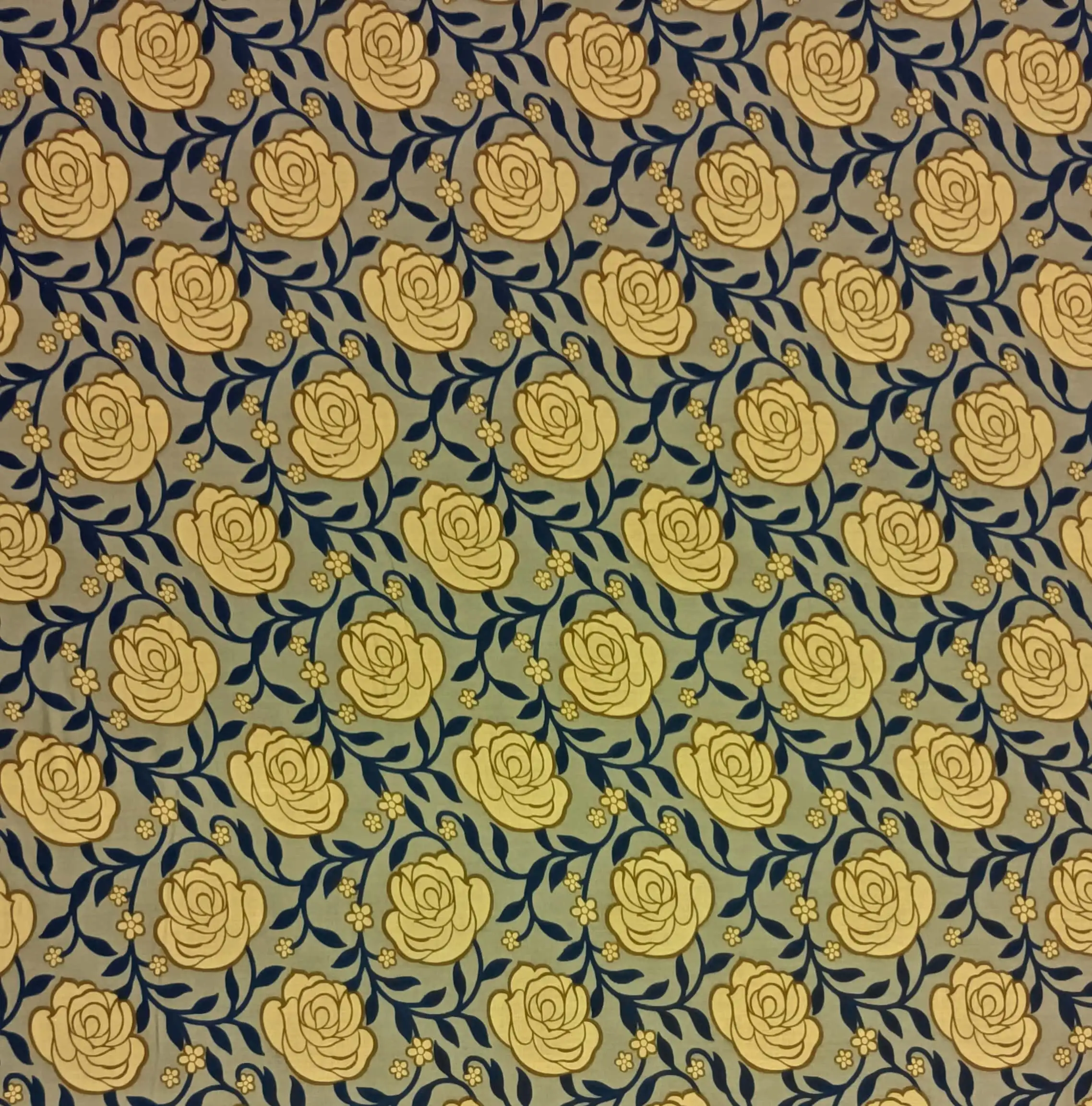 Floral1 Collection in Yellow. Soft khaki ground showing buttery yellow roses, navy-blue vines and golden daisy accents.