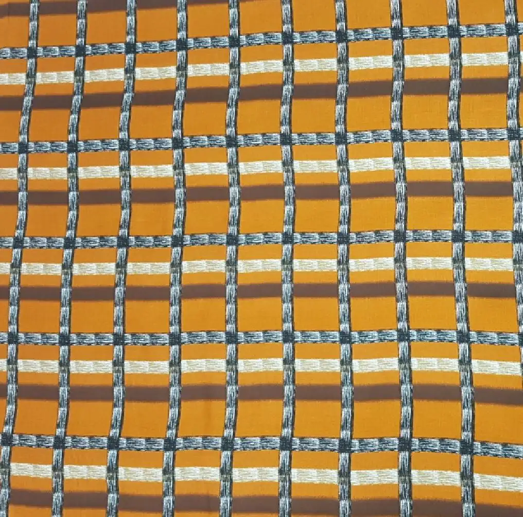Stripes and Dots7 Collection in Brown Yellow. Maroon-brown ground broken by blue and white streaked bars crossing into a muted plaid.