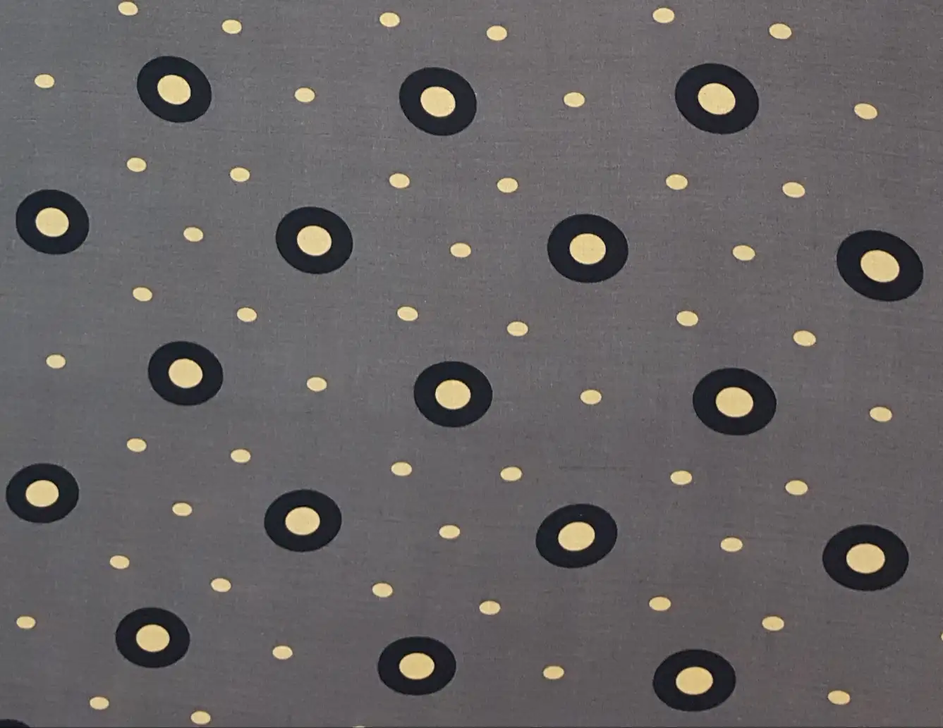 Stripes and Dots9 Collection in Grey. Taupe-grey ground sprinkled with gold and black-rimmed circles plus small yellow dots.