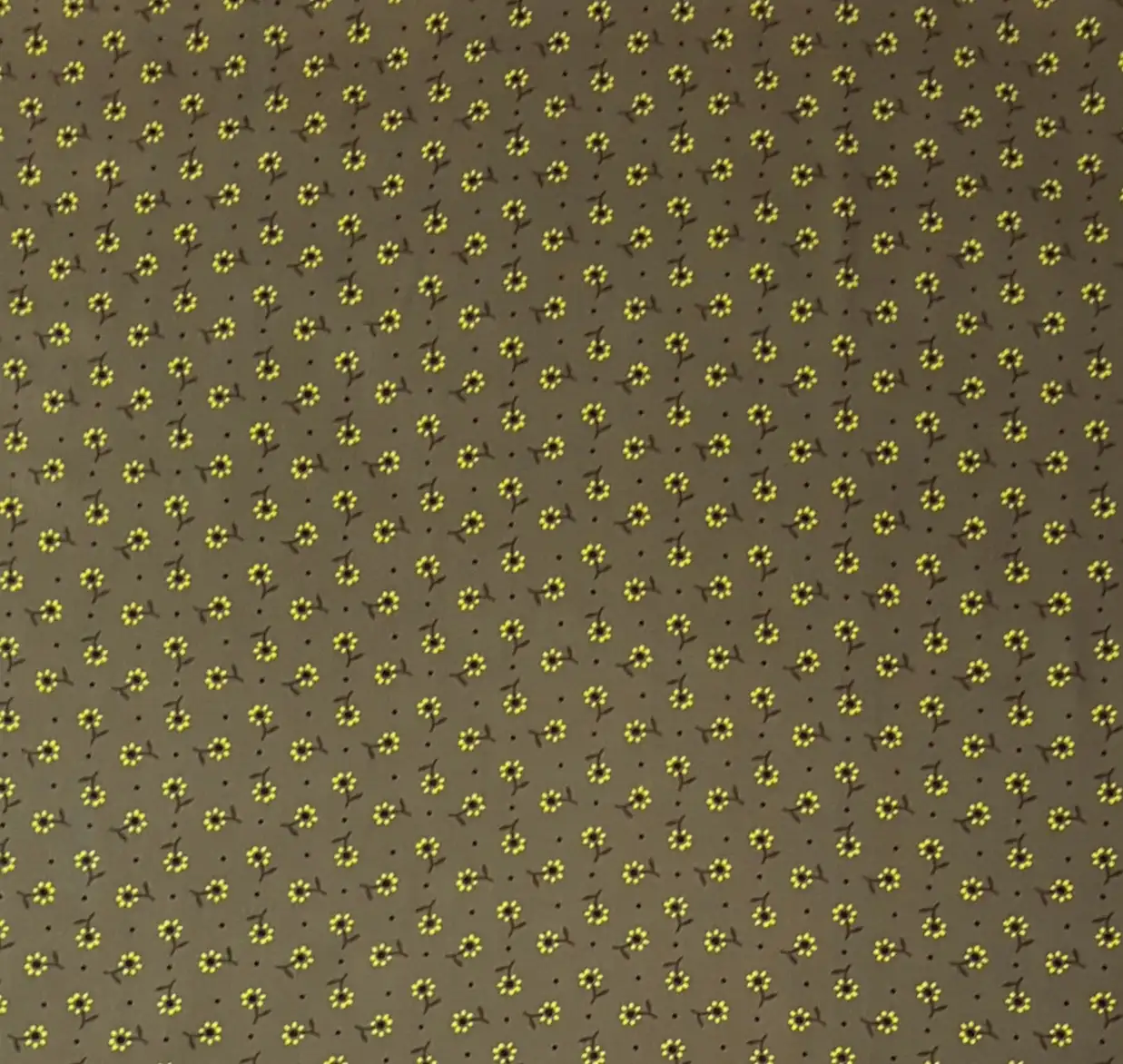 Floral5 Collection in Olive Green. Olive-khaki ground covered in bright yellow daisies with dark scattered sprig motifs.