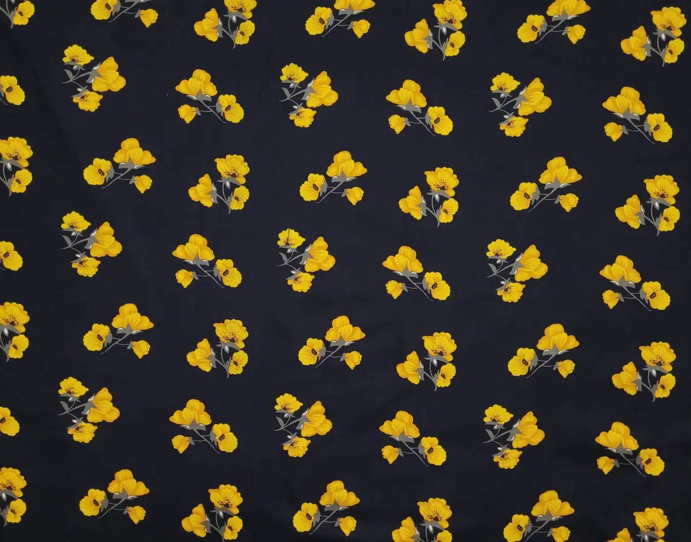 Floral12 Collection in Yellow Flower. Near-black ground showing vivid marigold-yellow blossoms paired with grey-green leaves and twigs.