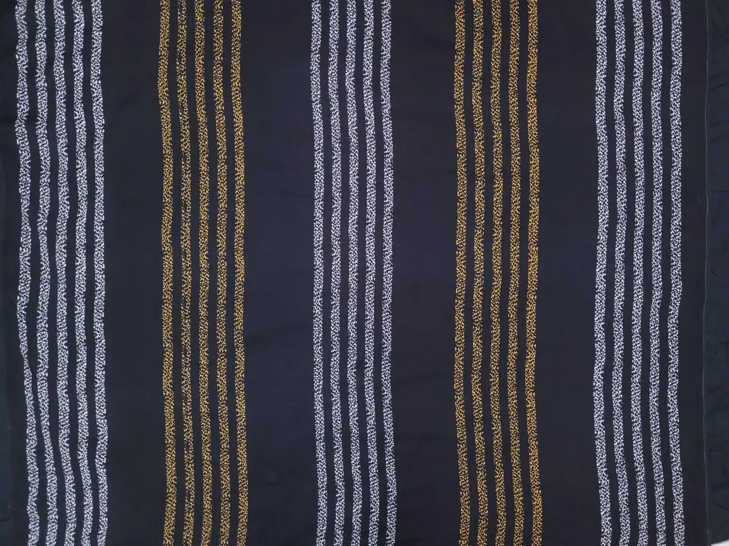 Stripes and Dots11 Collection in Yellow White. Slate blue-grey ground marked by repeating horizontal bands of bright yellow speckled dots.