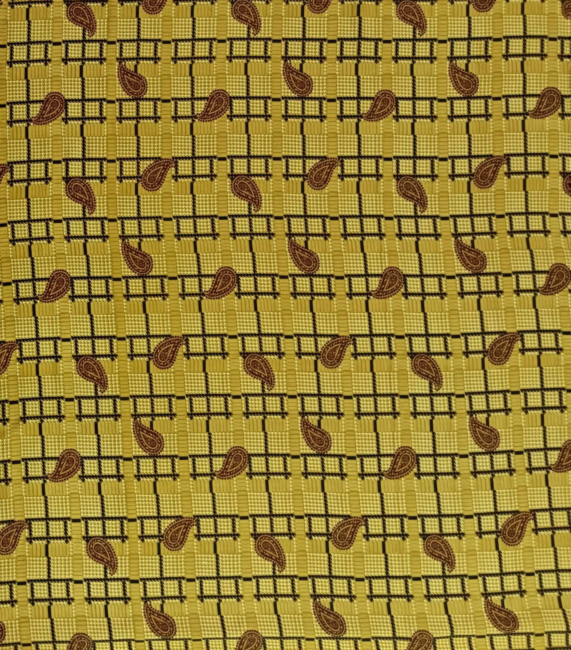 Geometric7 Collection in Yellow. Golden mustard ground woven with tan checks, brown grid lines and chestnut-brown paisley shapes.