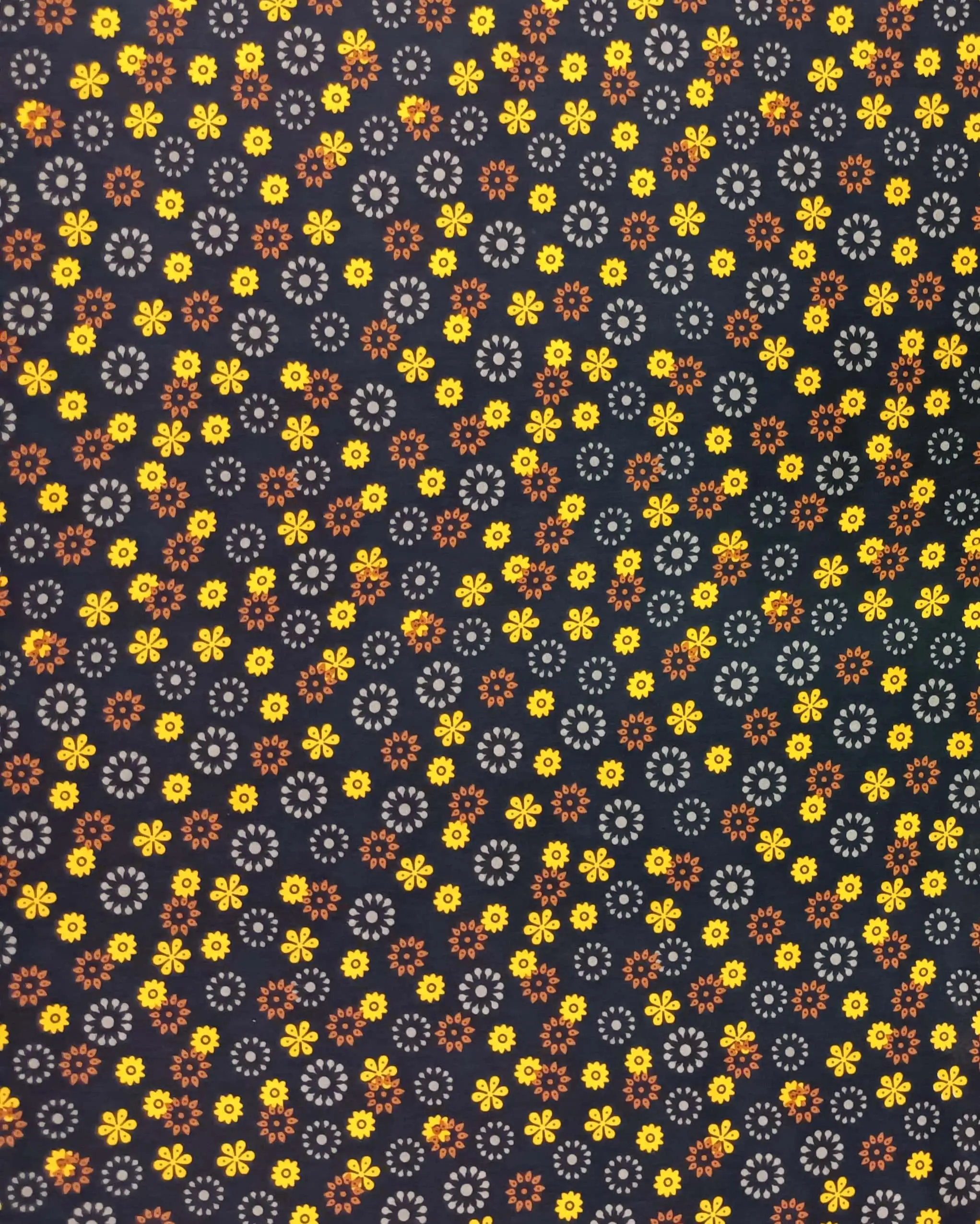Floral2 Collection in Yellow. Charcoal-black ground covered in amber yellow, rust, and grey flowers with sunny warmth.