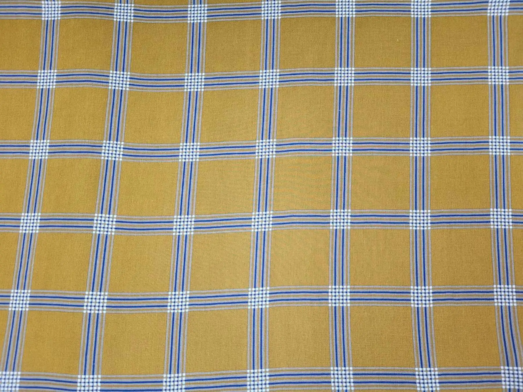 Stripes and Dots10 Collection in Yellow. Mustard-gold ground laced with white and dark stripe groups outlining large plaid squares.