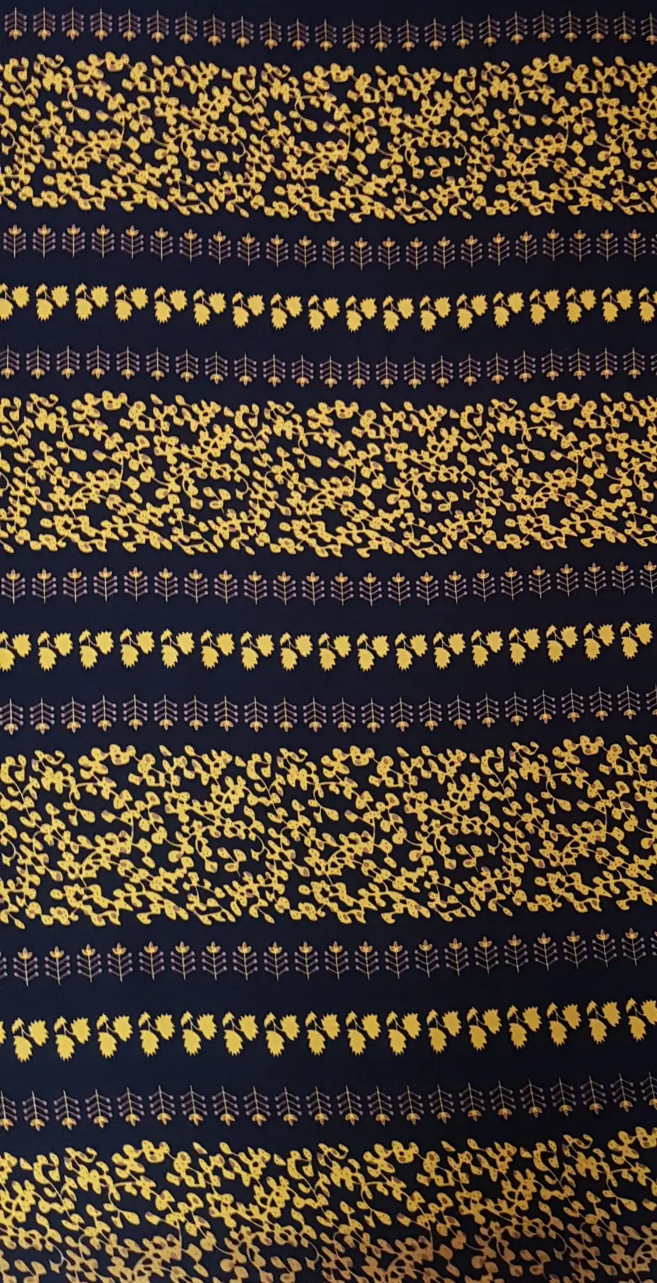 Floral15 Collection in Yellow. Black ground splashed with golden-yellow foliage and yellow rows of small upright leaf clusters.