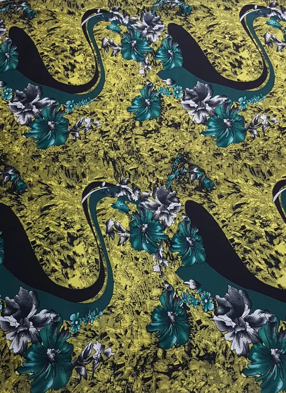 Floral19 Collection in Yellow. Chartreuse-yellow textured ground set with orange blossoms and dark green foliage.