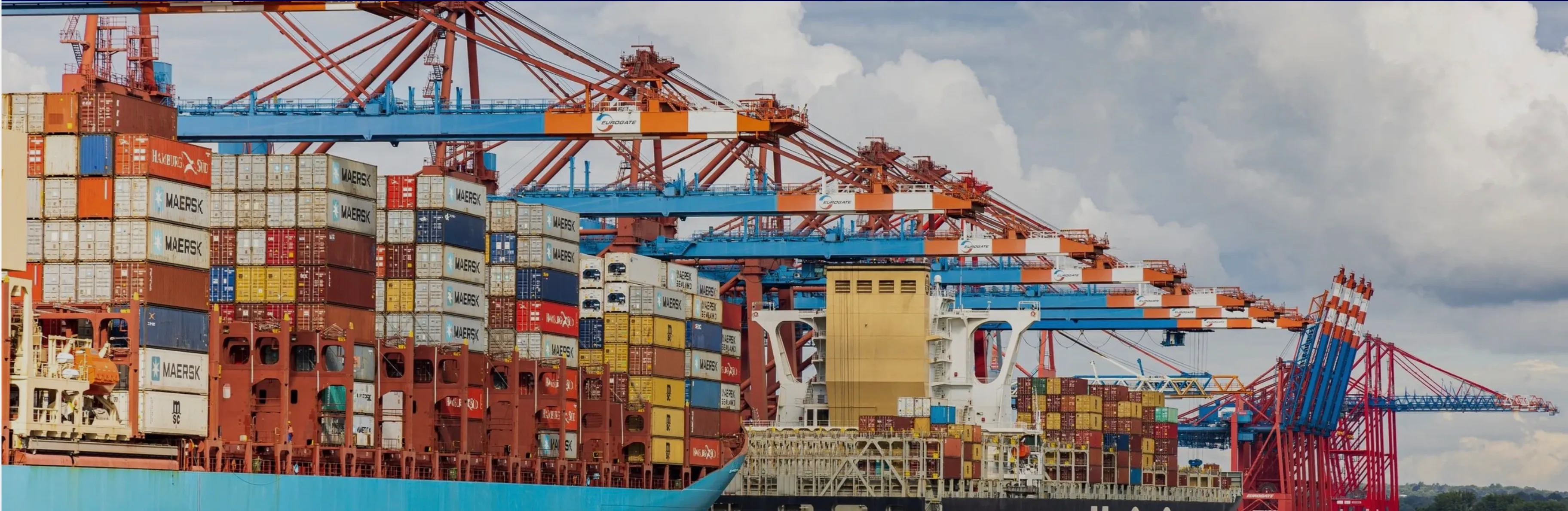 Container ships loading at port