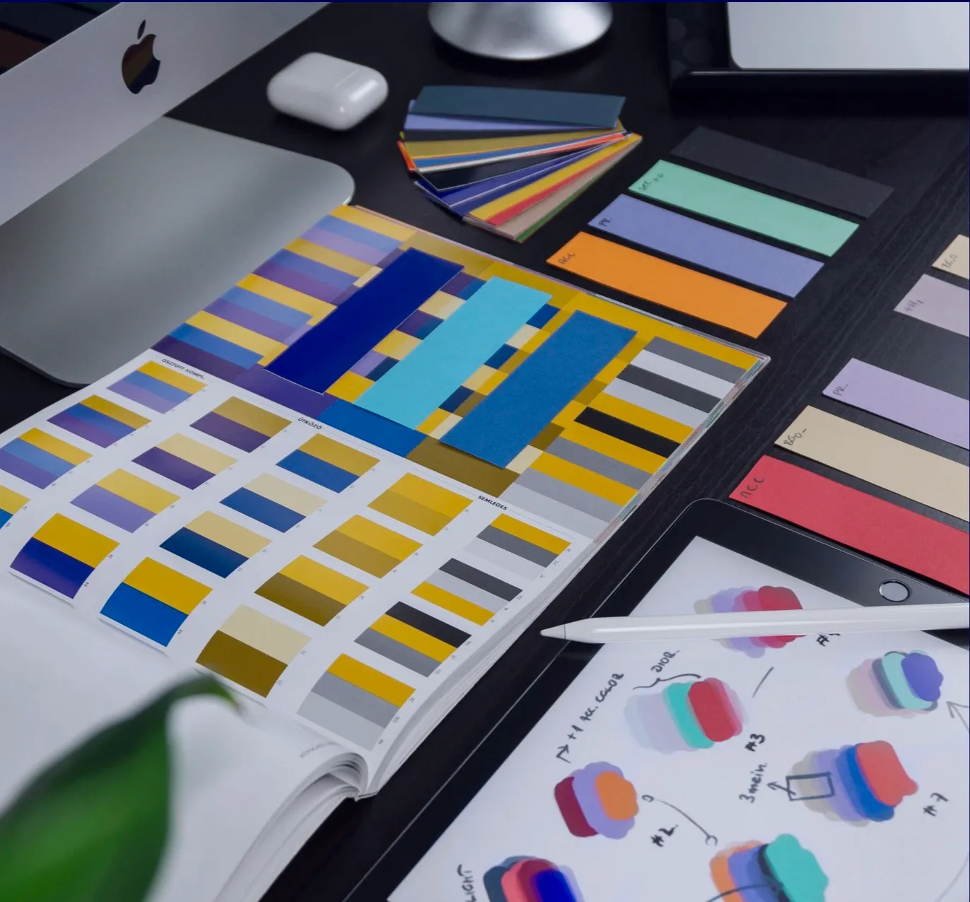 Colour swatches and design samples on a desk